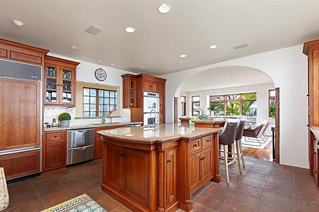 Spacious kitchen with wooden cabinetry and center island at 1135 Barcelona Drive
