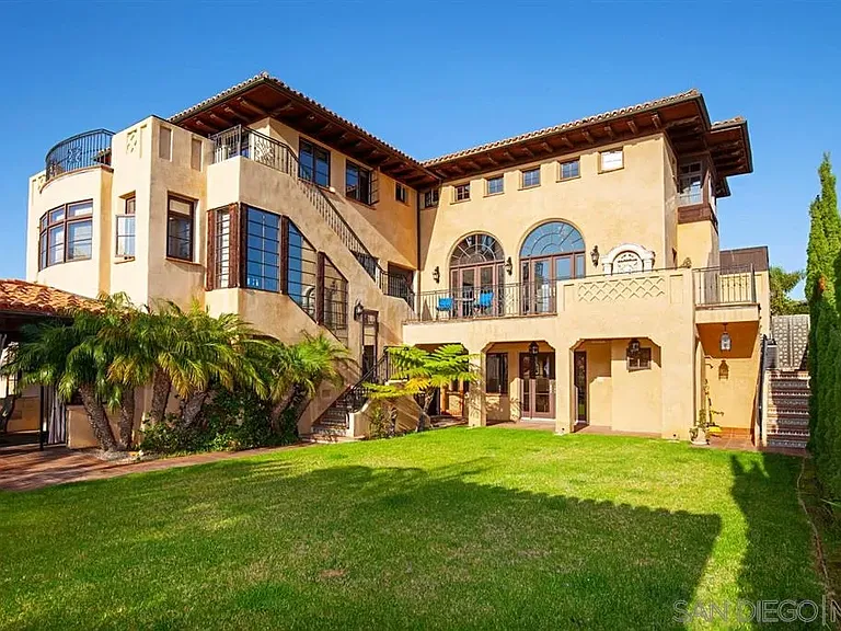 Mediterranean-style luxury home with landscaped front lawn at 1135 Barcelona Drive