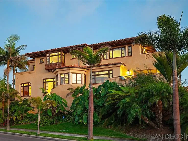 Mediterranean-style residence illuminated at dusk at 1135 Barcelona Drive