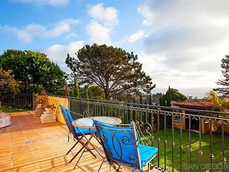 Spacious backyard with outdoor recreation area and mature trees at 1135 Barcelona Drive