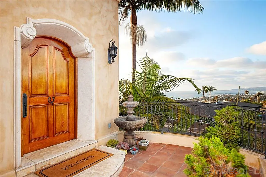 Arched entrance and landscaped patio overlooking San Diego Bay at 1135 Barcelona Drive