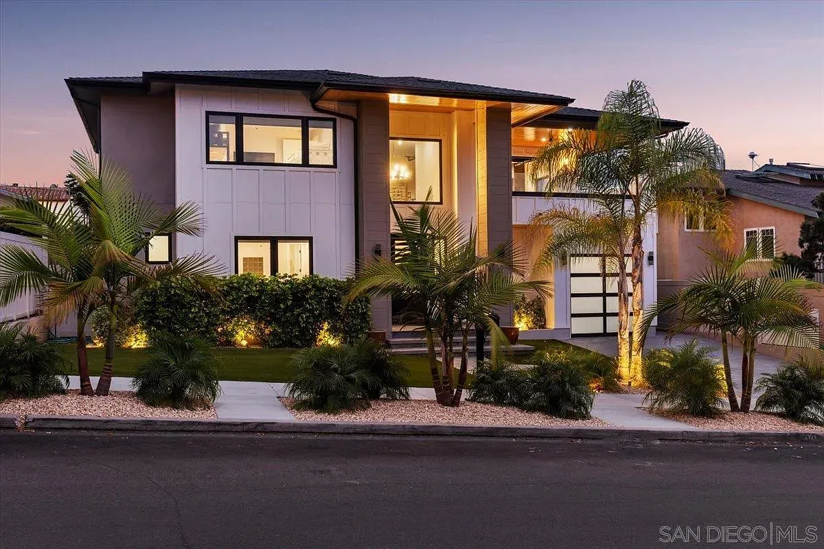 Contemporary luxury residence at 4515 Tivoli Street illuminated at dusk