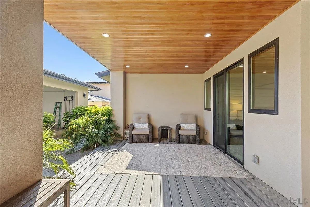 Covered outdoor seating area with wood-paneled ceiling at 4515 Tivoli Street