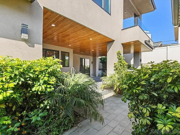 Private outdoor courtyard with covered patio and contemporary architecture
