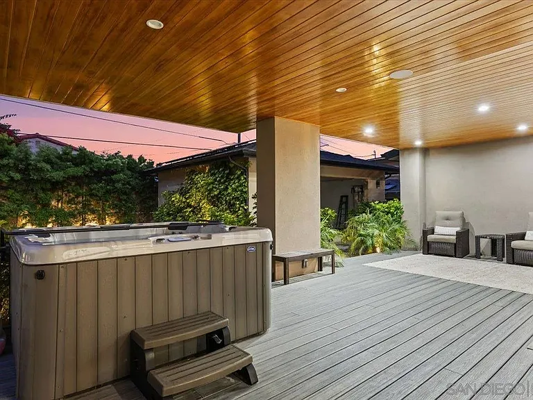 Modern outdoor kitchen with built-in barbecue and spacious rooftop terrace