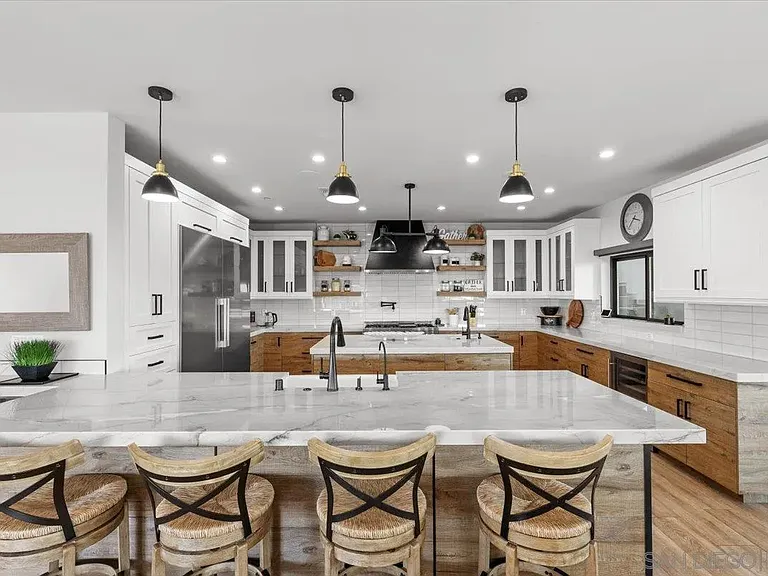 Contemporary kitchen with large island and pendant lighting at 4515 Tivoli Street
