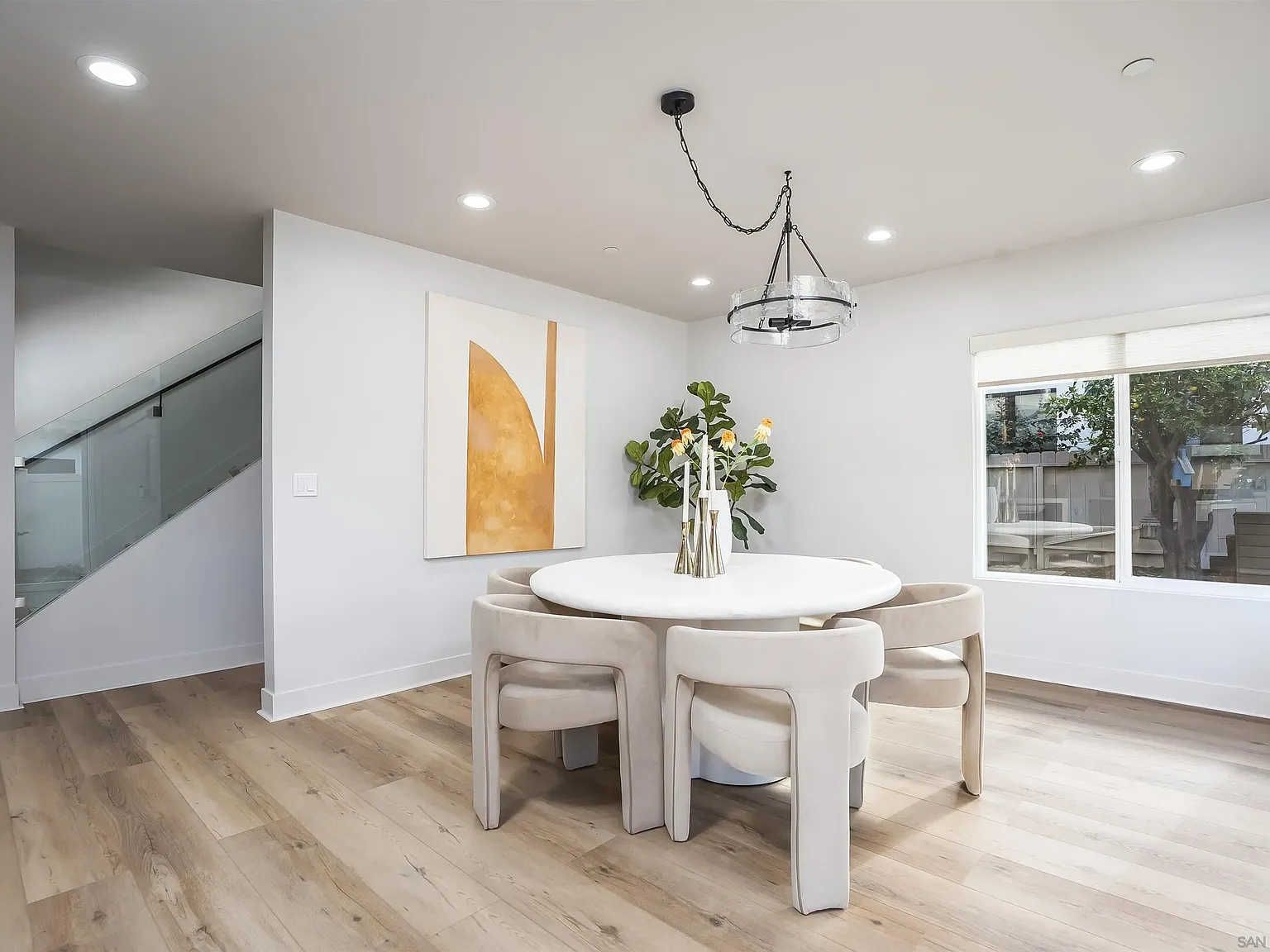 Open dining area with modern lighting and white walls at 4593 Coronado Avenue