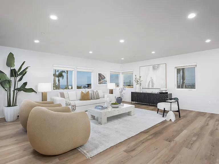Bright contemporary living room with large windows at 4593 Coronado Avenue
