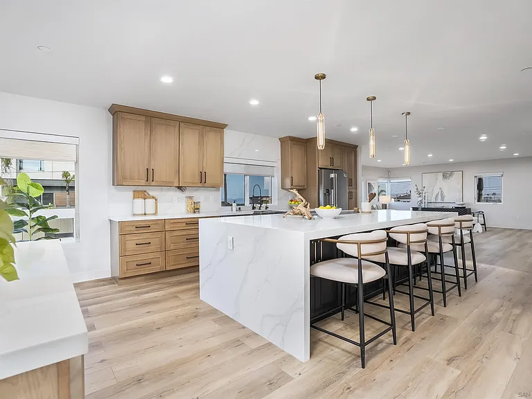 Spacious kitchen with island and open living area at 4593 Coronado Avenue