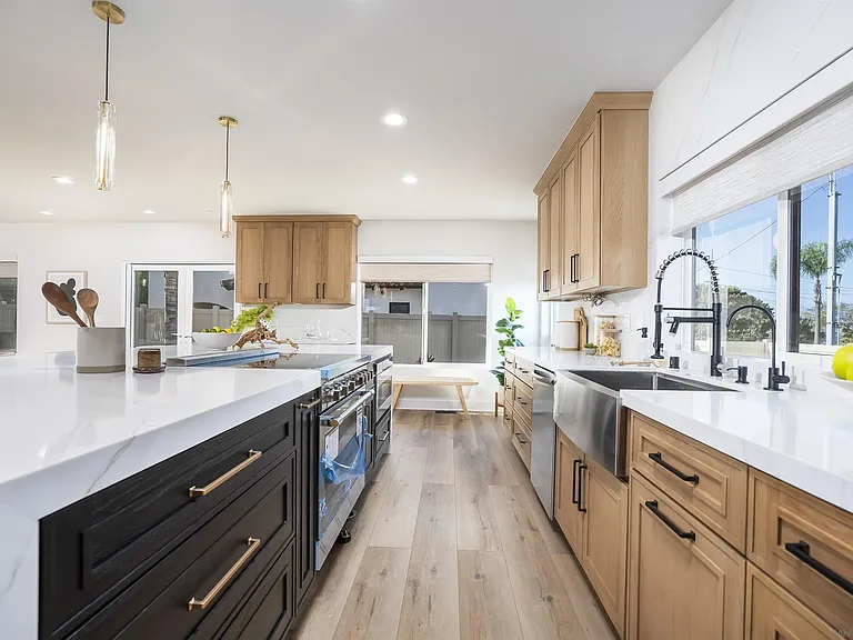 Modern kitchen with white cabinetry and stainless steel appliances at 4593 Coronado Avenue
