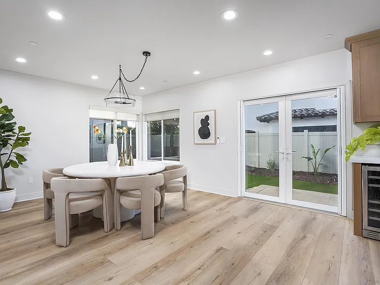 Contemporary dining area with large windows and natural light at 4593 Coronado Avenue